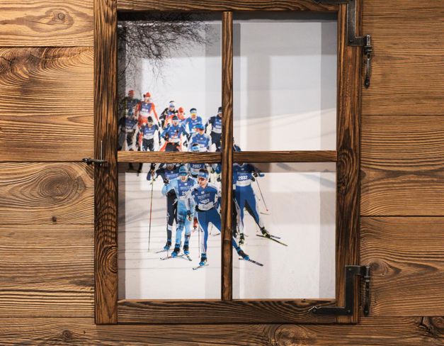 Cross-country ski race seen through a wooden window